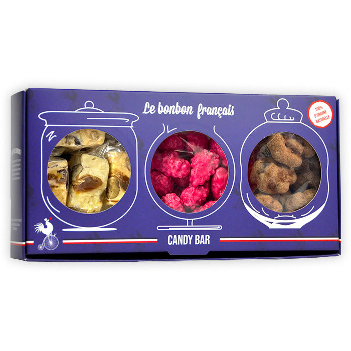 Coffret bleu Candy Bar avec trois fenêtres rondes révélant nougat au caramel, praline de lyon et croc noix du quercy