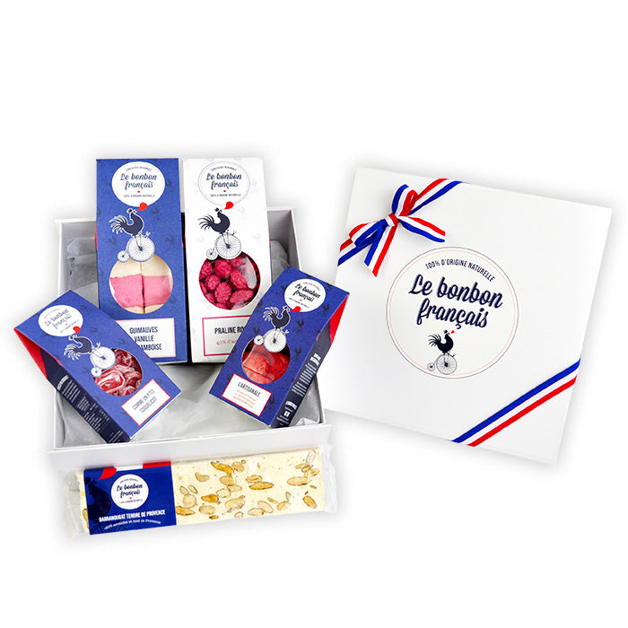 Coffret Les Gourmets ouvert avec packs guimauve, praline, coquelicot et artisanale, et une barranougat